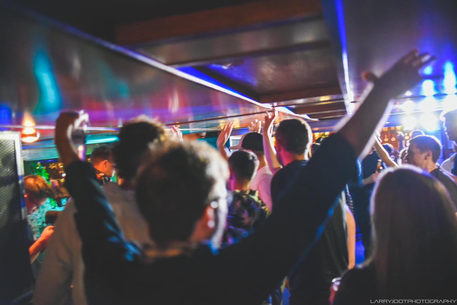 Hands in the air at Disco Waves boat party